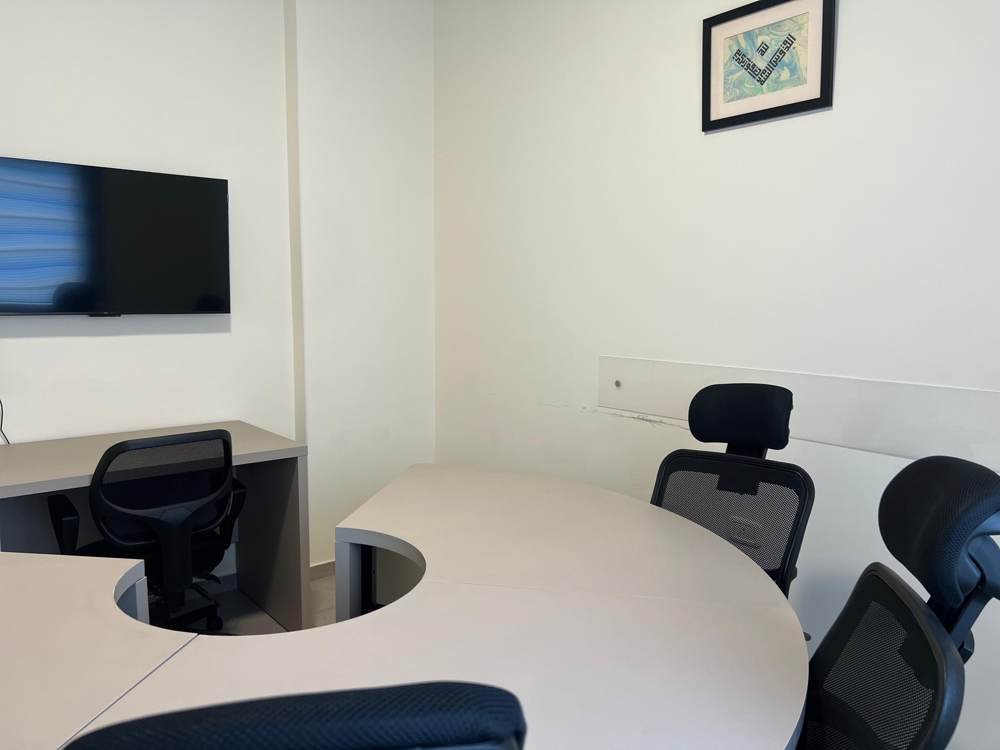 Meeting room with screen and curved table