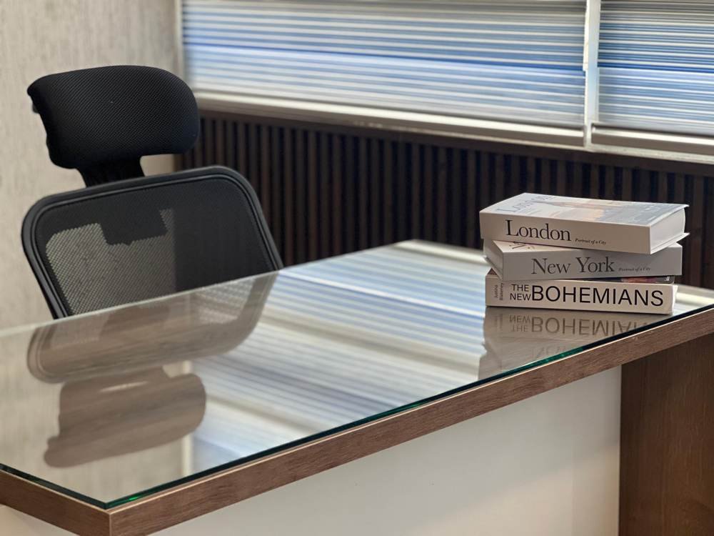 Private office desk with books